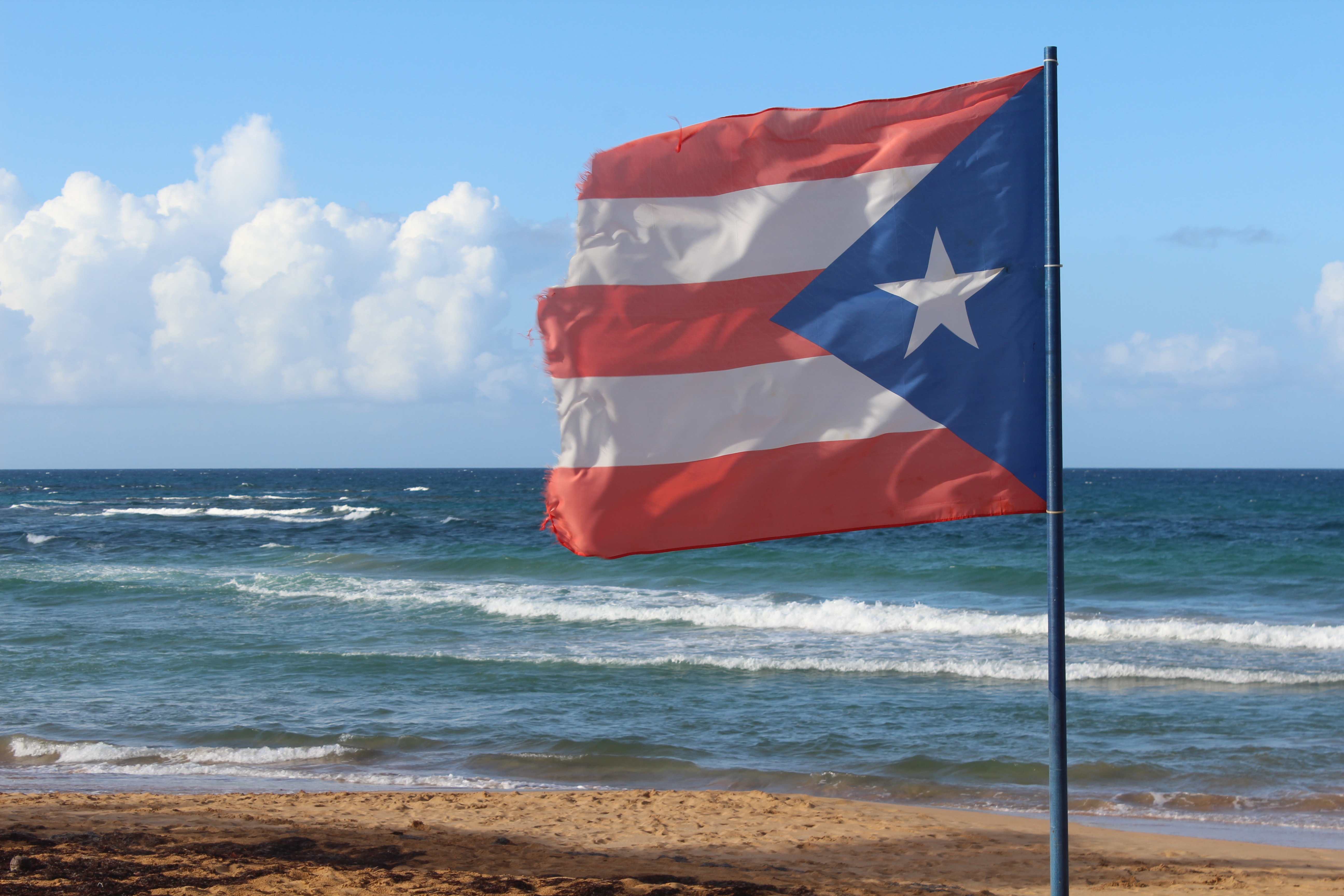 Puerto Rican Flag flying on a sunny beach